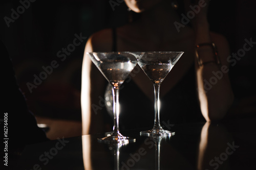 Two glasses of martini coctail in a bar