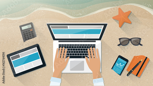 Businessman working on the beach