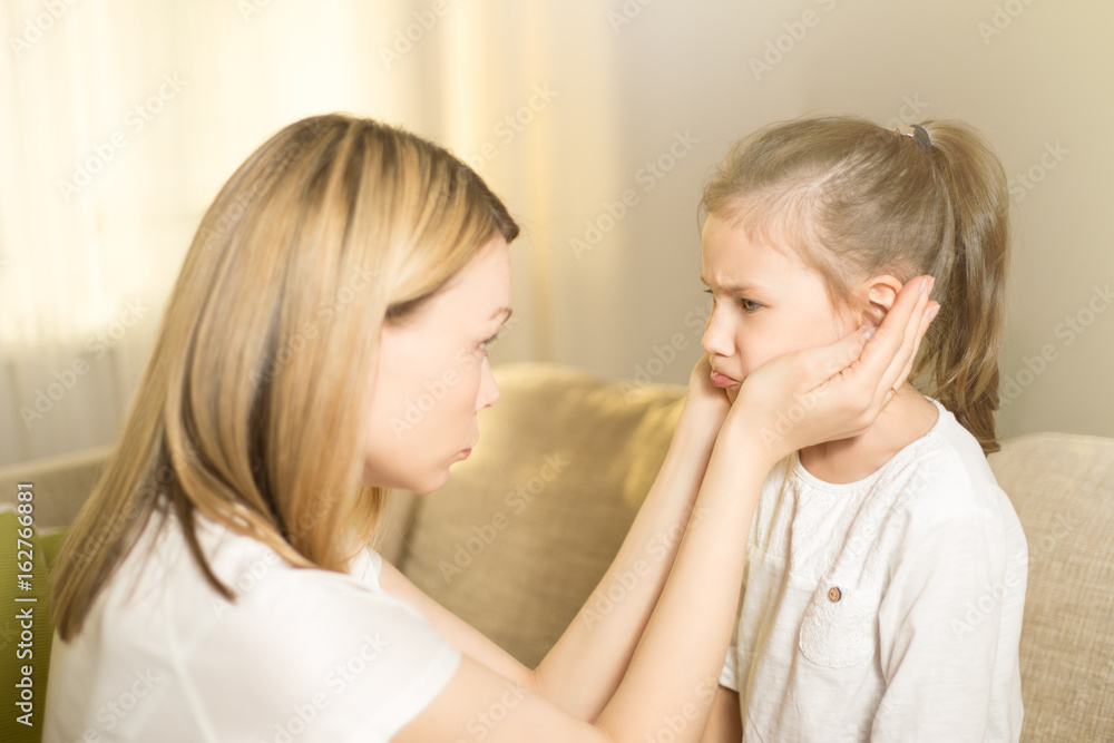 Happy loving family. Beautiful mother is comforting his young frustrated daughter. Happy loving family. Beautiful mother is comforting his young frustrated daughter.