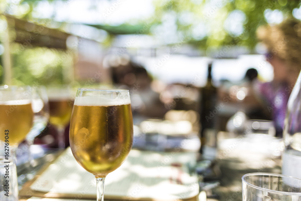 Fresh blond beer on an outdoor party close up Fresh blond beer on an outdoor party close up