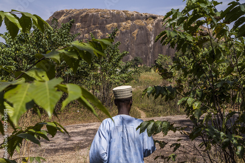 Fulani elder showing the way to his village photo