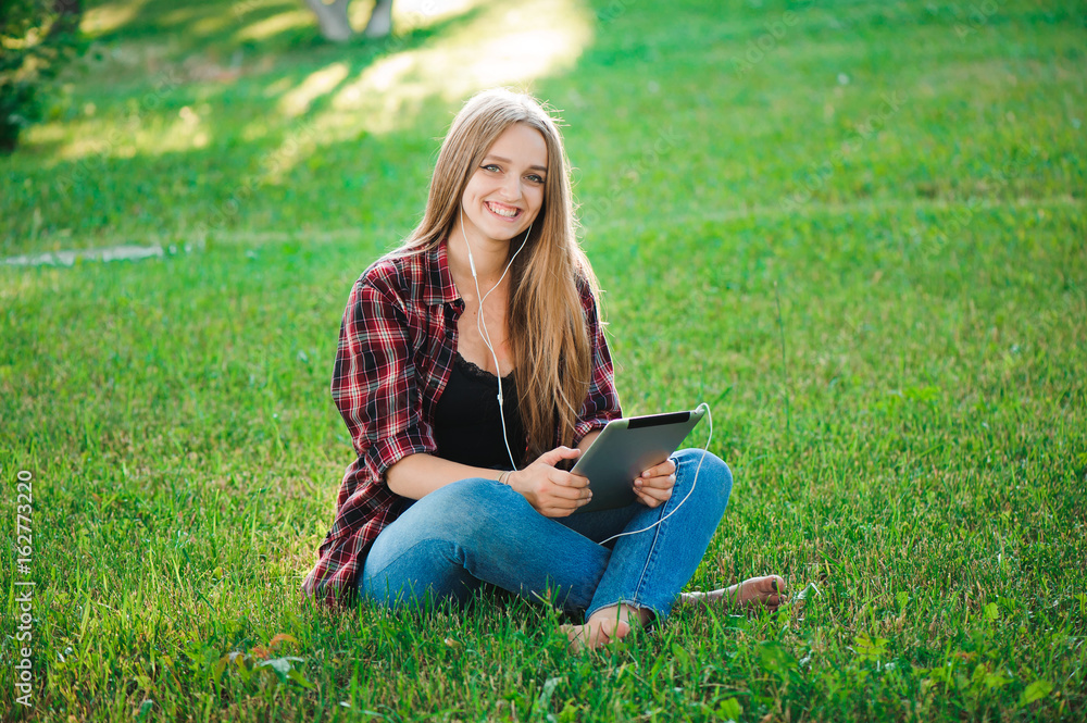 Happy Hipster Girl Using Tablet Outdoors Happy Hipster Girl Using Tablet Outdoors