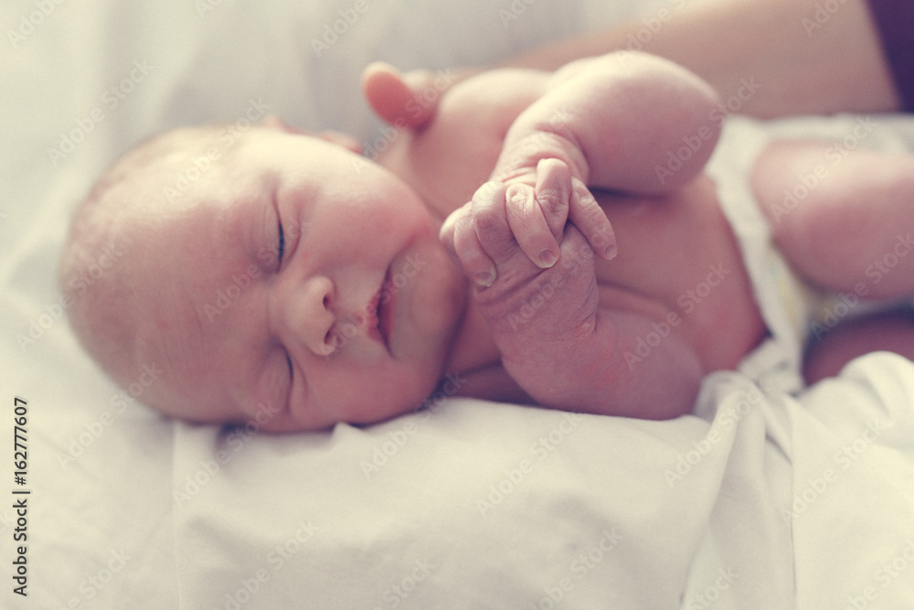 Newborn folding hands in prayer Newborn folding hands in prayer