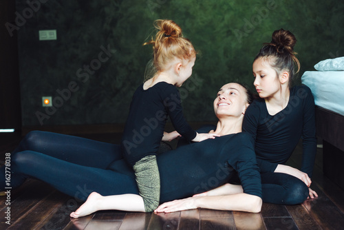 Mom and two daughters spend time together