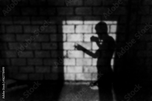 Man Silhouette at Brick Wall