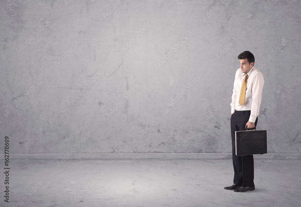 Fototapeta premium Young businessman standing confused