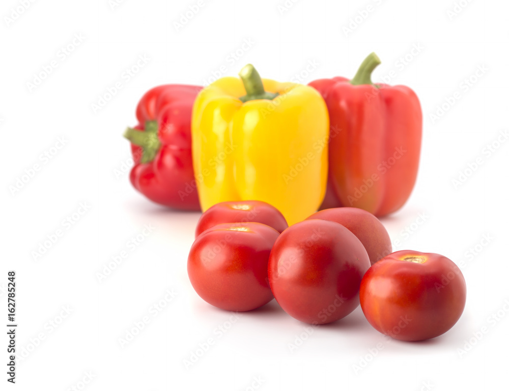 Red tomatoes and pepper on a white background