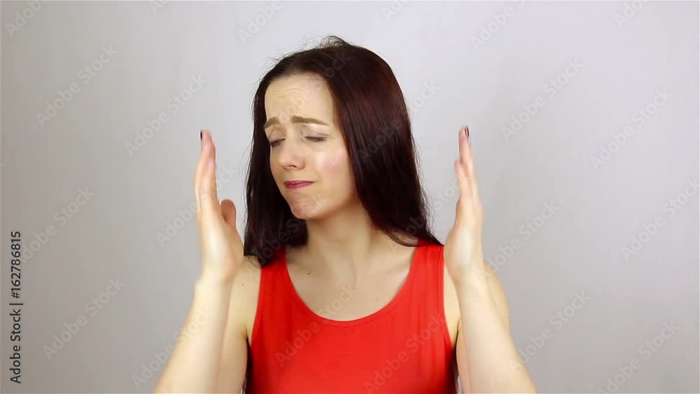 Portrait of a beautiful young woman. The gesture of chagrin Portrait of a beautiful young woman. The gesture of chagrin