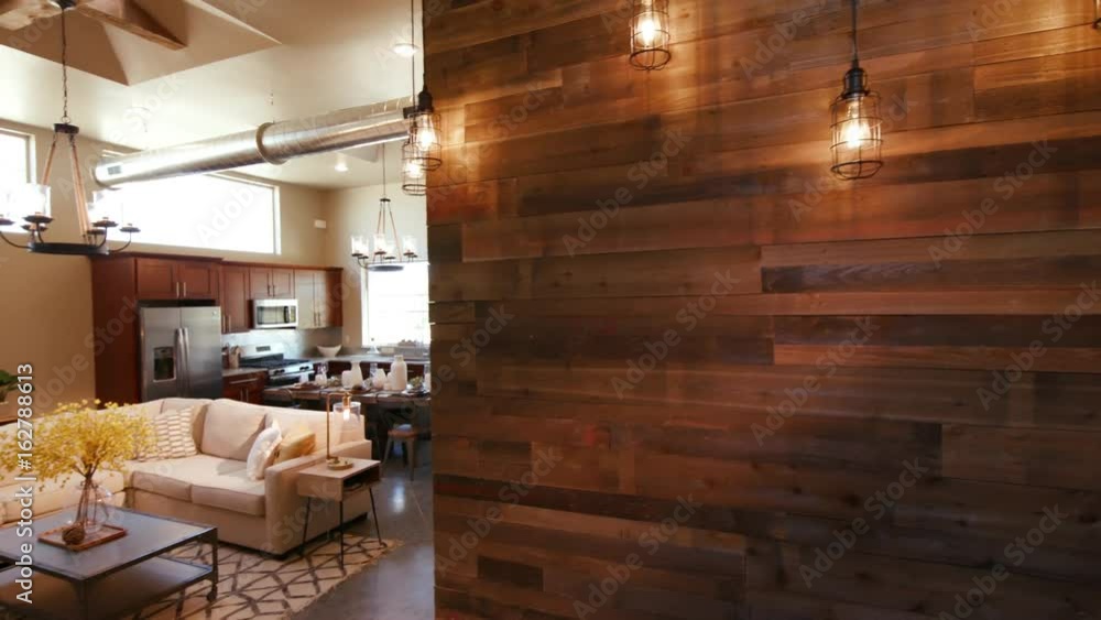 Wood Wall and Lights Panning and Lowering to Main Living Room Open Layout. panning and lowering left from a reclaimed wood wall with vintage lights to show open loft style living area
Wood Wall and Lights Panning and Lowering to Main Living Room Open Layout. panning and lowering left from a reclaimed wood wall with vintage lights to show open loft style living area