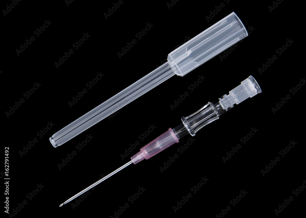Injection needle with syringe casing isolated on black background Injection needle with syringe casing isolated on black background