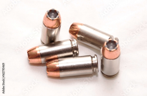 Five 40 caliber hollow point bullets