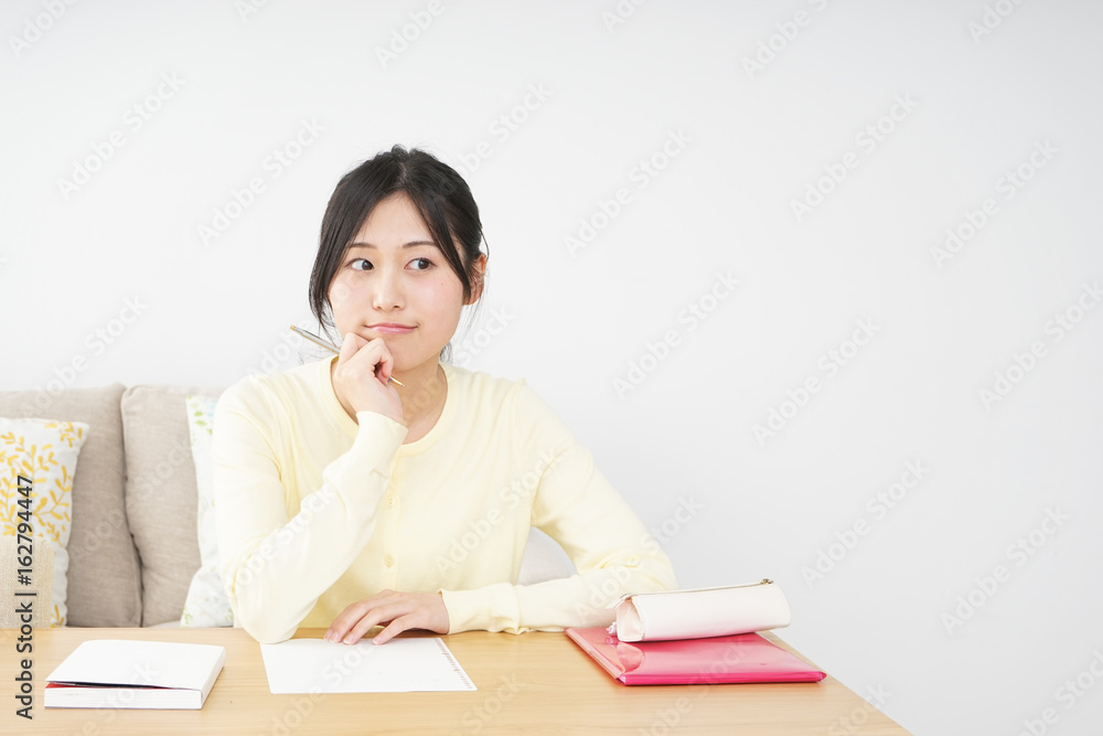 Young woman studying at home Young woman studying at home