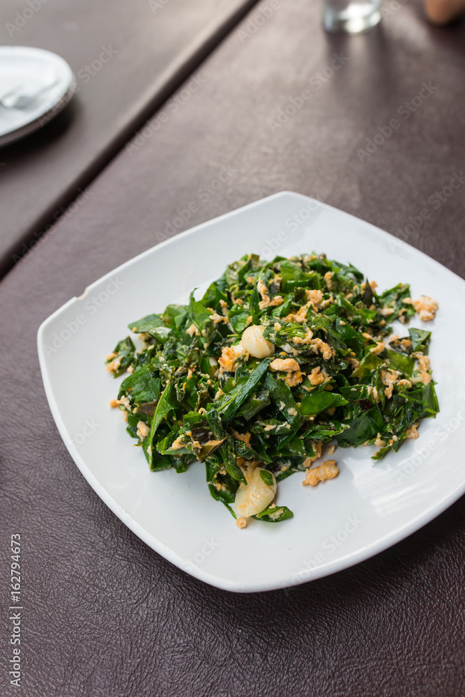fried Gnetum gnemon leaves with egg fried Gnetum gnemon leaves with egg