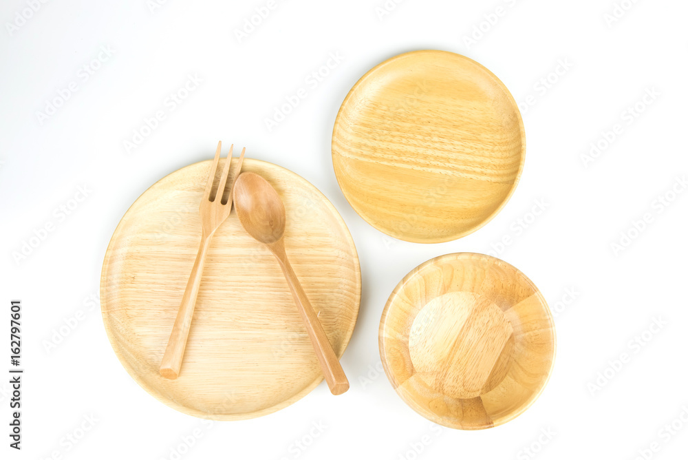 Wood plate, spoon and fork on a white background. Wood plate, spoon and fork on a white background.
