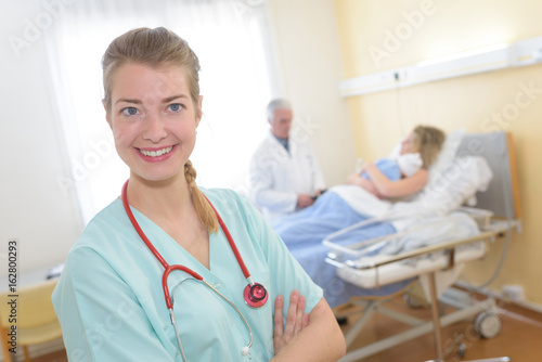 happy young nurse patient at the background