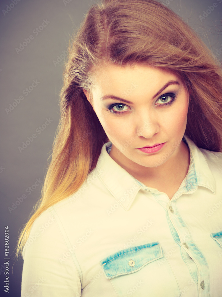 Attractive blonde woman with windblown hair Attractive blonde woman with windblown hair