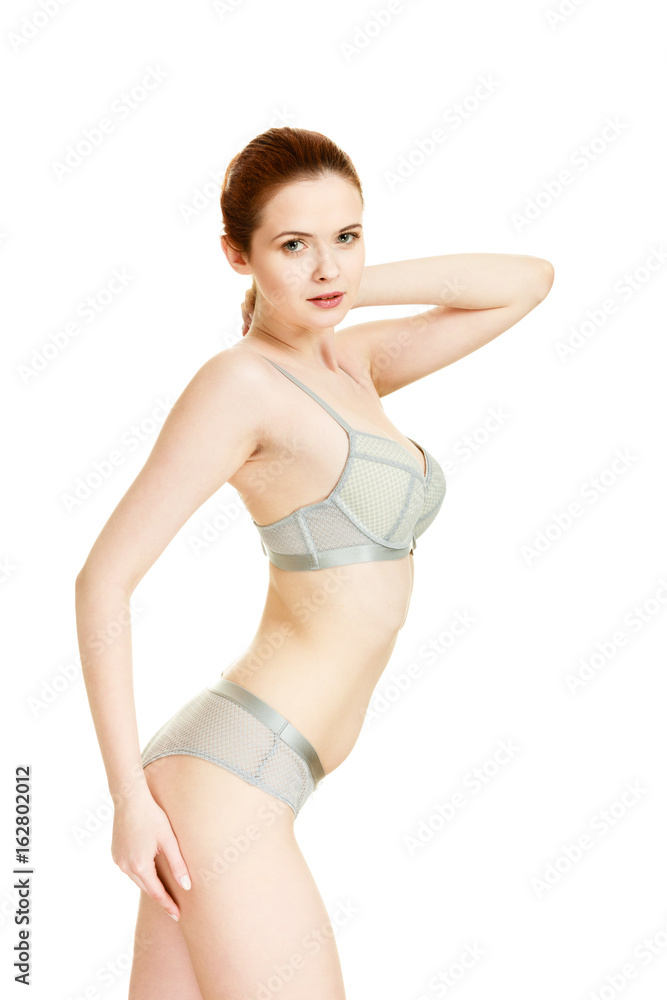 Attractive slim woman in grey matching underwear