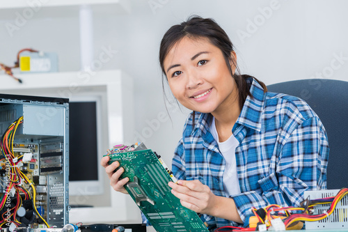Wallpaper Mural woman fixing a computer hard drive Torontodigital.ca