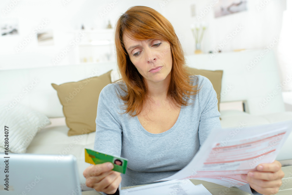 ill woman checking her medical insurance ill woman checking her medical insurance