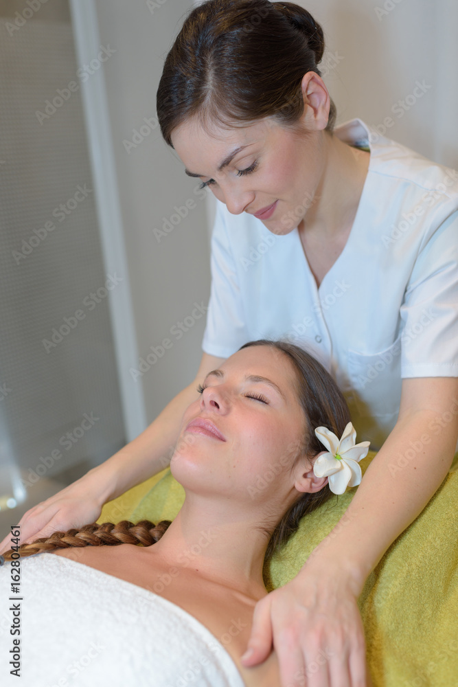beautiful young woman lying with closed eyes in spa beautiful young woman lying with closed eyes in spa
