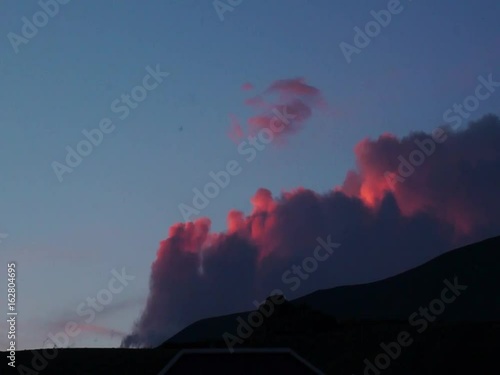Colored clouds drifting in sunset or sunrise sky, speed up footage
