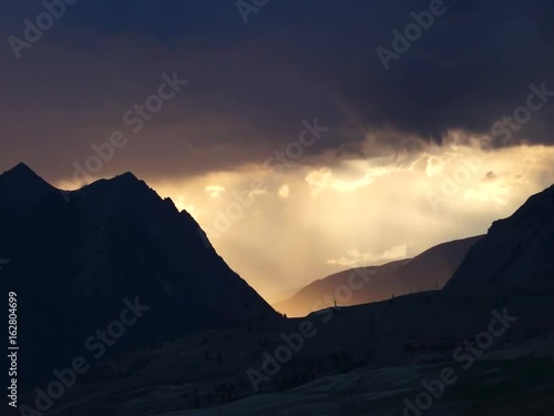 Colored clouds drifting in sunset or sunrise sky, speed up footage