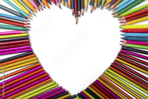 Colorful pencils and heart symbol