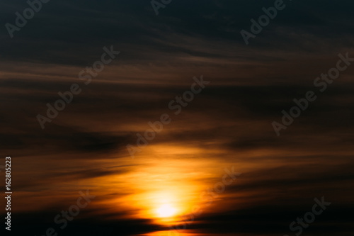 Abstract blurred sky with orange sunset