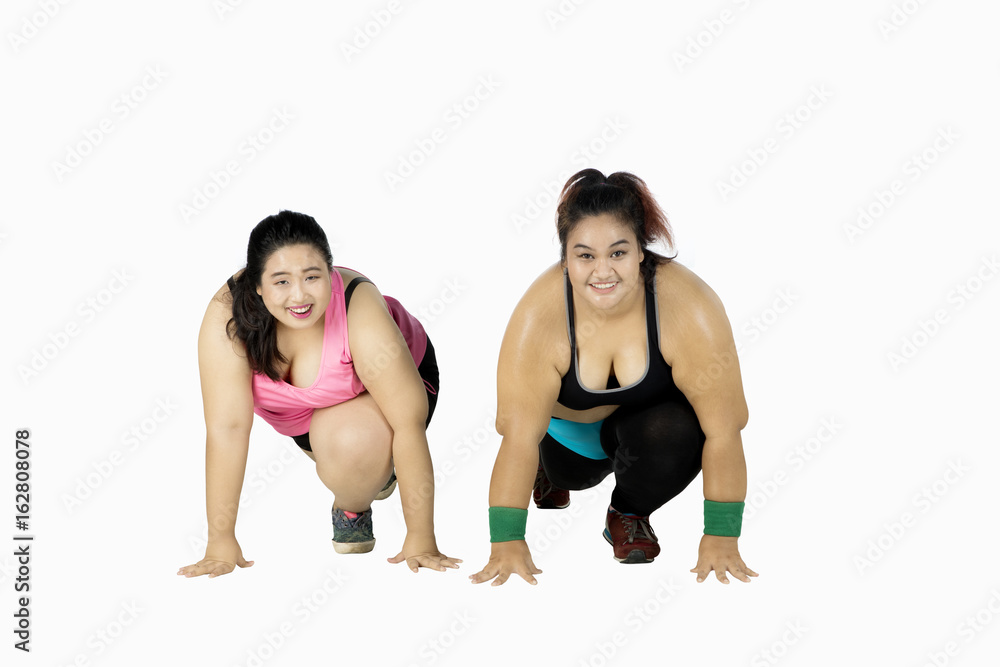 Overweight women ready to run on studio Overweight women ready to run on studio