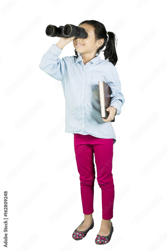 Schoolgirl looking something with binoculars Schoolgirl looking something with binoculars