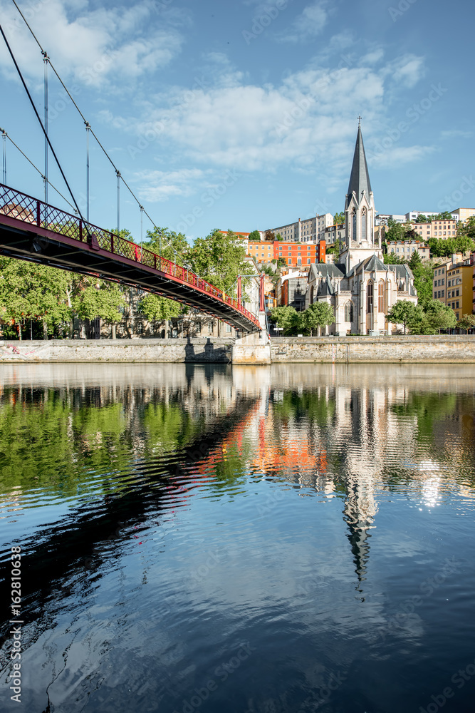 Morning view on the riverside with saint George cathedral and footbridge in the old town of Lyon city