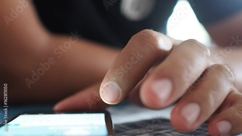 Man hand using touchscreen smartphone. Fingers make gestures touching, swiping and typing screen for chat and social network.