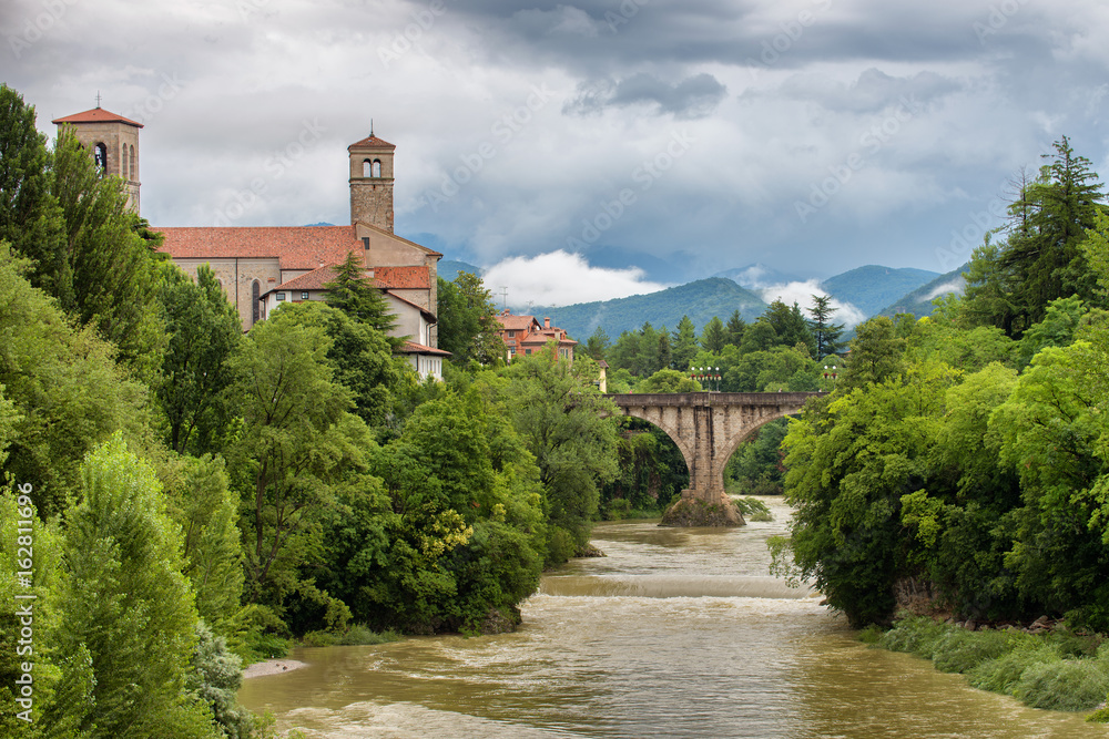 Cividale and natisone river under a cloudy summer sky