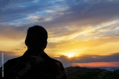 Silhouette of man at the sunset.