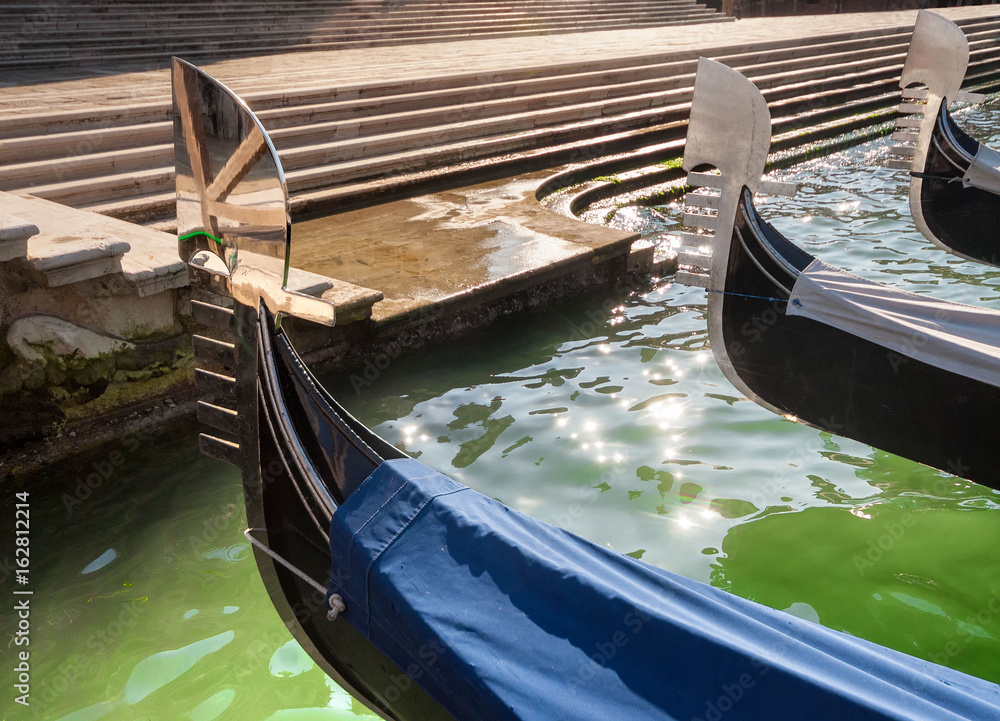 Three gondolas moored in the Grand Canal, Venice, Italy