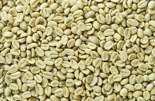 Konstfotografi Unroasted green Arabica coffee beans flat surface