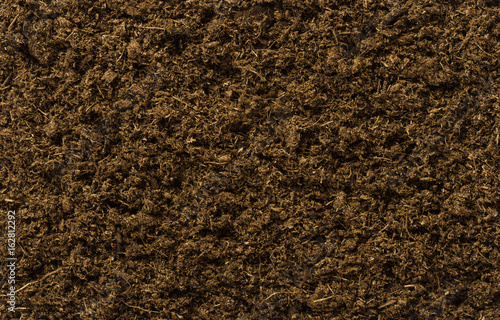 Potting soil flat surface. Also called potting mix or compost, a medium to grow plants with peat, also called turf. Backgrounds. Closeup macro photo directly from above.