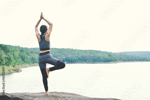 Beautiful women yoga in nature, hipster tone and selective focus