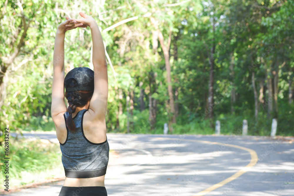Women warm up before running on the road for health, color of hipster tone selective and soft focus Women warm up before running on the road for health, color of hipster tone selective and soft focus