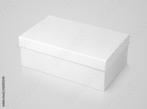 Closed shoe white paper box on gray background with clipping path photo