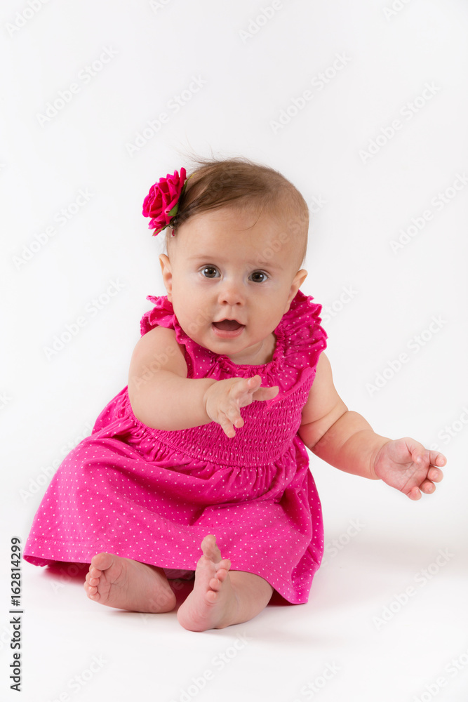 Baby girl in pink dress on white background Baby girl in pink dress on white background