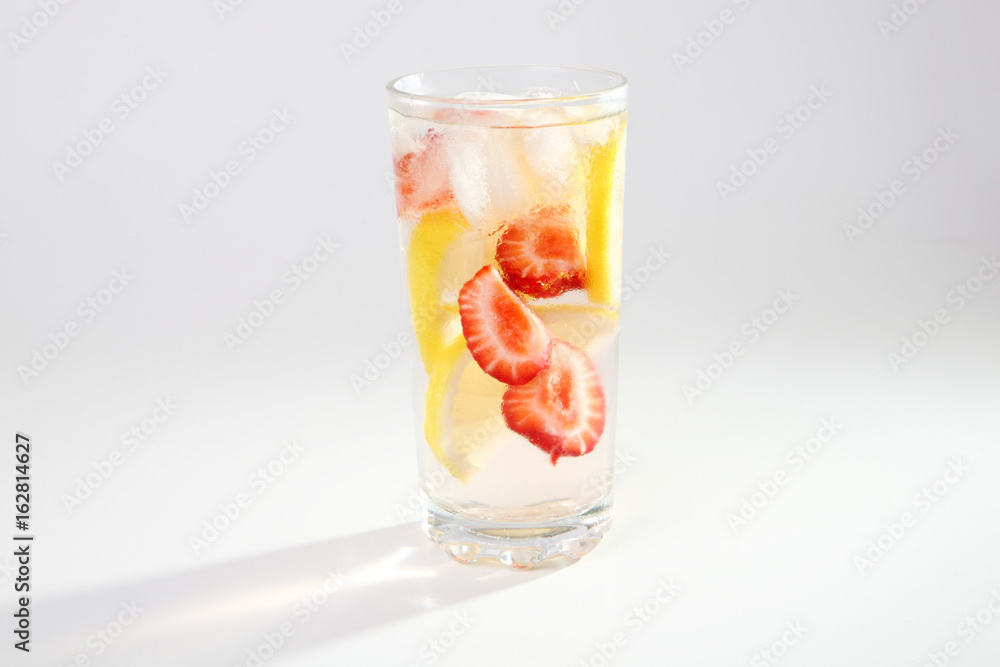 Fototapeta premium Cold cocktail with lemon and strawberries