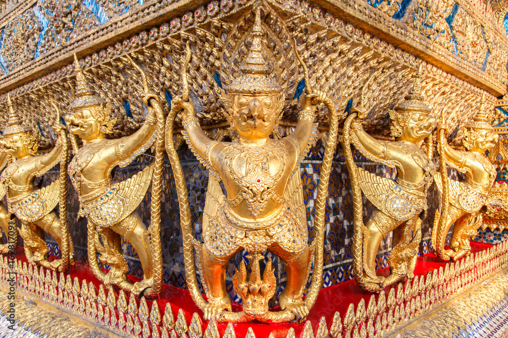Perspective view of golden religious statue (Statue Garuda) in wat phra kaew temple, Bangkok, Thailand.