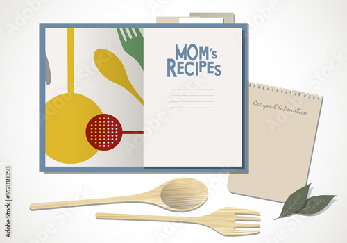 Cookbook with mom's recipes. Wooden spoon and fork and bay leaves