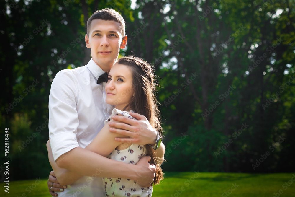 Fototapeta premium lovers hugging in forest