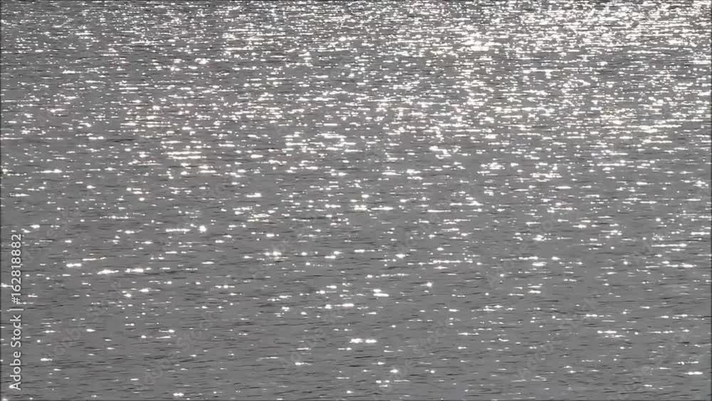 sun reflection on silver water
sun reflection on silver water