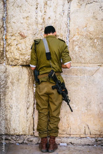 Israeli soldier on Western Wall in Jerusalem, Israel