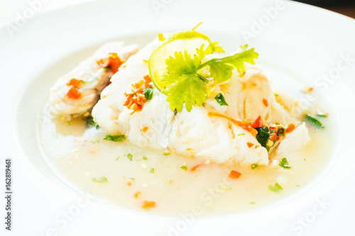 Steam fish fillet meat with lemon spicy sauce