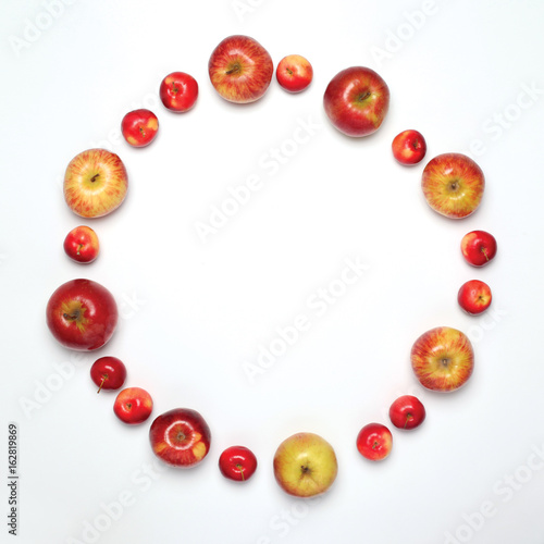 Food concept - many apples fruits in the shape of circle isolated on white background, flat lay, empty copy space