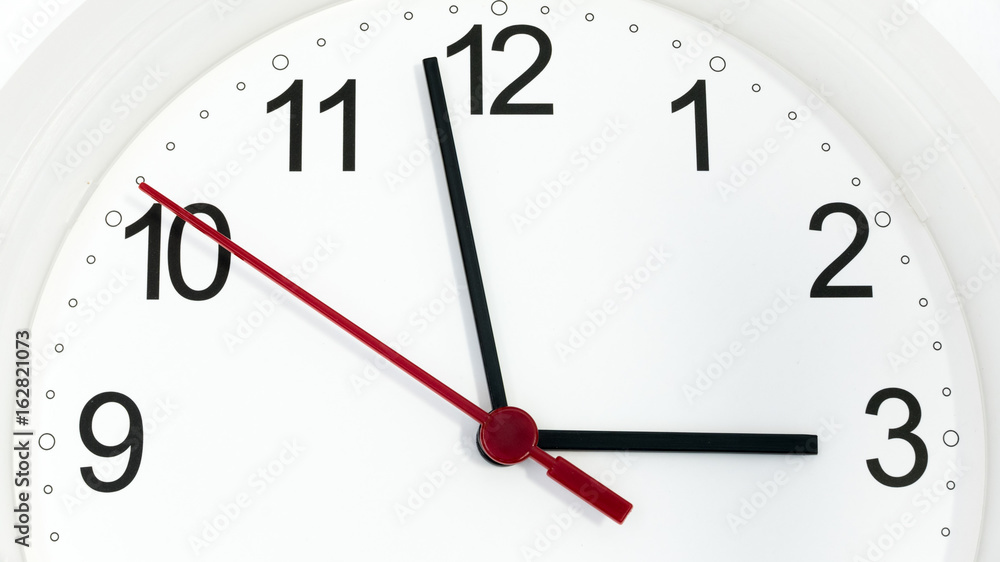 Closeup clock ticking showing three hours Closeup clock ticking showing three hours
